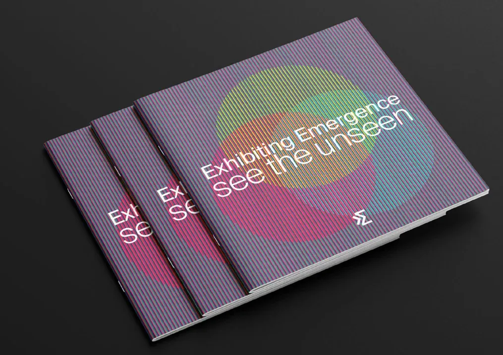 Mockup of the event booklet with a purple striped cover and overlapping coloured circles.